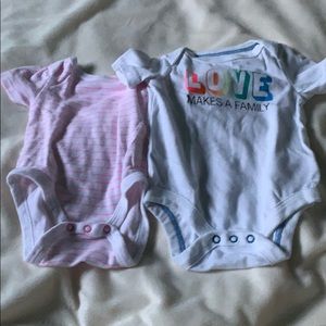 Two baby onesies